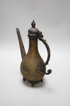 An Indian Islamic brass ewer, 27cm high